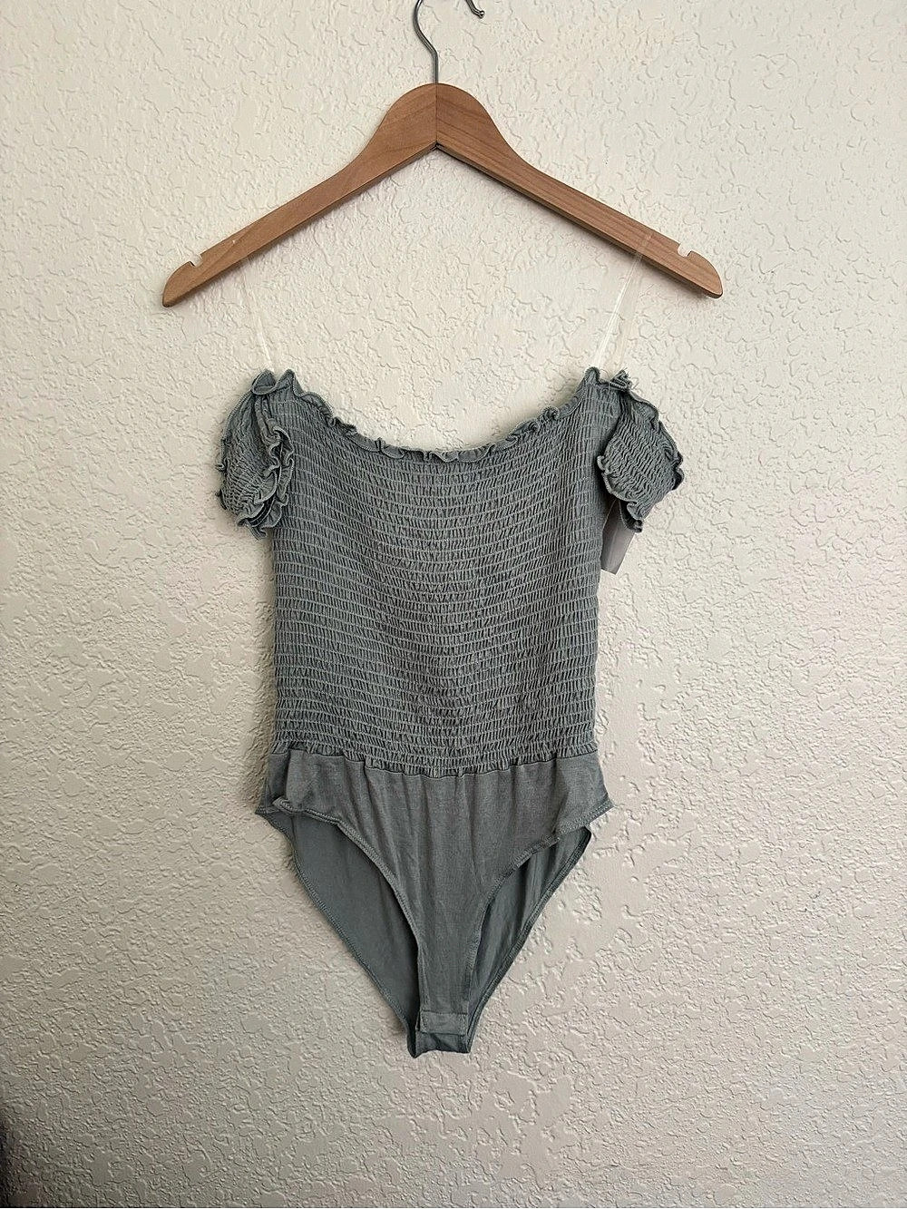 Charlotte Russe green bodysuit with ruffled sleeves and smocked texture